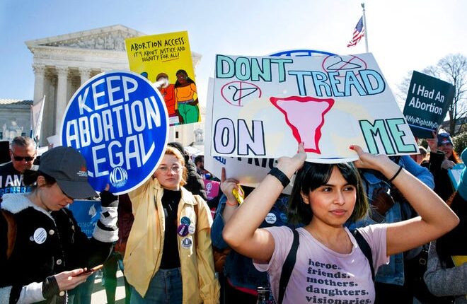 In this file photo dated March 4, 2020, protesters for abortion rights gather outside the Washington Supreme Court.  Abortion rights activists are relieved and optimistic as the Biden government takes over.