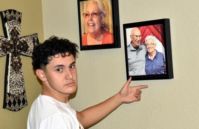 Joe Estrada shows a photo of his grandparents Leopoldo and Ofelia Estrada, who died of COVID-19 in late 2020.  Estrada and his family sat down for an interview on September 27, 2021 at the Estrada family home.
