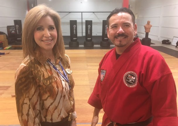 Eli Guzman, owner of Guzman Martial Arts, looks over his new dojo with Loretta Pina, general manager of the Mesilla Valley Mall.
