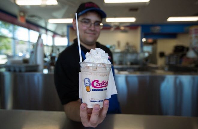 Mario Hernandez holds a Caliche's Pumpkin Pie caliche, a fall favorite in the Mesilla Valley.