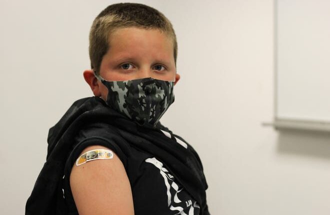 Luke Garcia, 6, shows off his Baby Yoda bandage after receiving his first dose of the COVID-19 vaccine.  Friday November 5th, 2021 was the first day COVID-19 vaccines were distributed to children ages 5-11 in Las Cruces.
