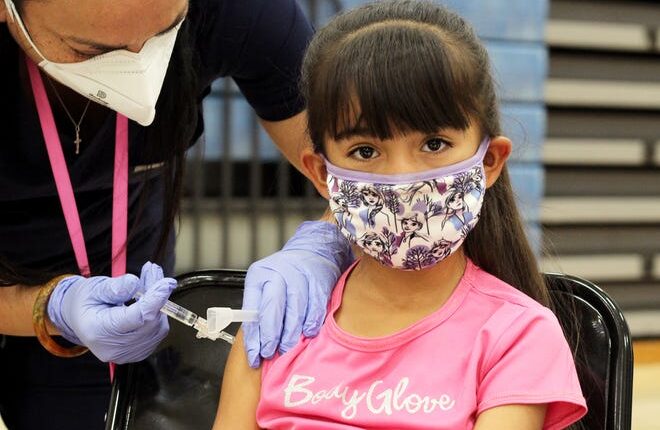 Emma Corrales, 6, will receive her first dose of the COVID-19 vaccine for children ages 5-11 at Vista Middle School on Thursday, November 18, 2021.