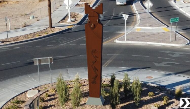Indian pueblo cultural center adorned with statues

