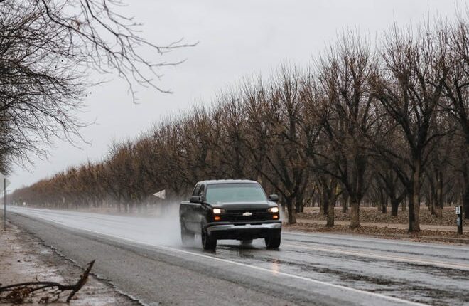 A truck drives up Valley Drive in the rain in Doña Ana county on Monday, December 9, 2019.