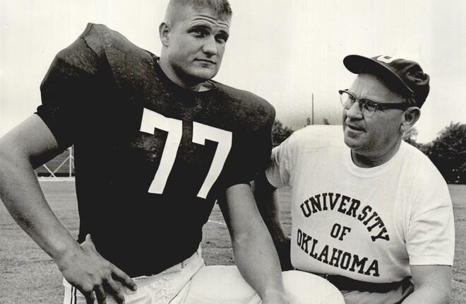 Ralph Neely as an offensive lineman at the University of Oklahoma with head coach Gomer Jones in 1964.