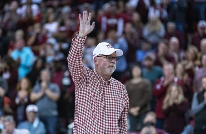 Jerry Kill accepts an NMSU football helmet as the New Mexico State Aggies play University of New Mexico Lobos on Tuesday, November 30, 2021 at the Pan American Center in Las Cruces.