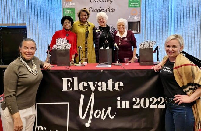 Marci Dickerson and Sumer Rose-Nolan (front) pose with The Association's International Women's Day event speakers Ammu Devasthali, Julia Brown, Wanda Bowman and Barbara Hubbard on March 8, 2022.