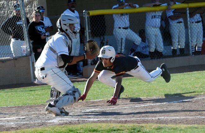 Centennial's Xavi Gutierrez scores all the way from second base as Organ Mountain catcher Xavier Cases awaits the ball on Friday at the Field of Dreams Baseball Complex.