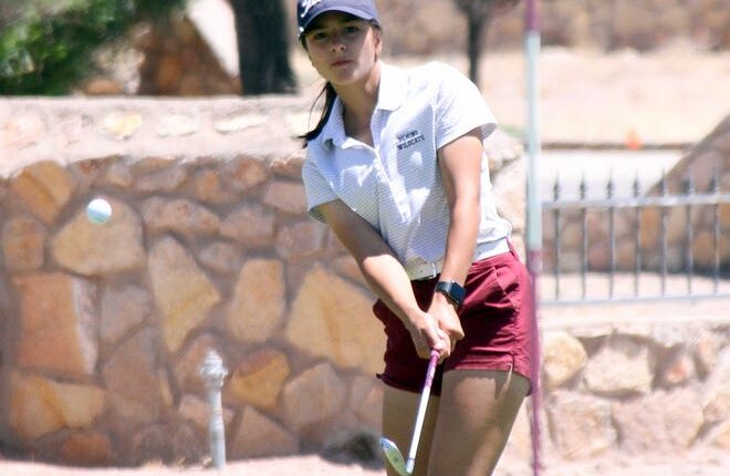 Junior Lady 'Cat Daniela Flores chipped onto the No.  9 green during Thursday's Deming Invitational Golf Tournament at the Rio Mimbres Golf Course.  Deming High girls won the team title with a season-best 329 score.