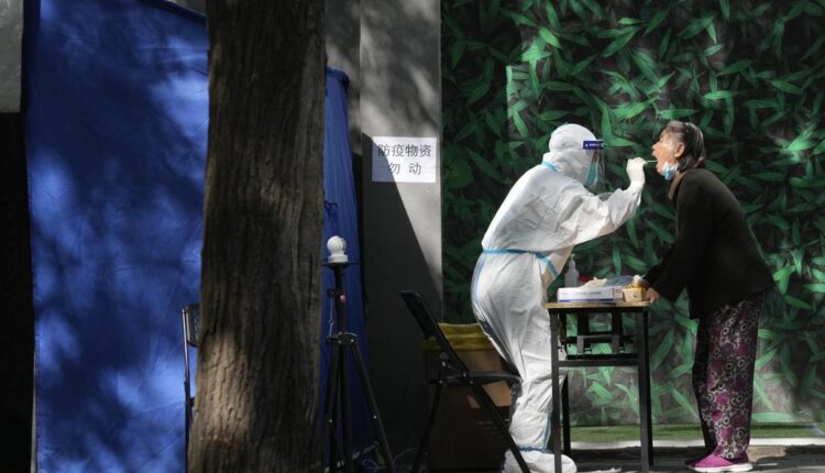 Beijing preps COVID-19 hospital spaces, though new cases low
