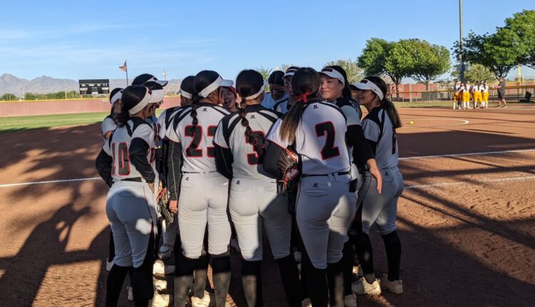 The Centennial High softball team huddles before its first round 5A playoff game against Cibola Friday, May 6, at the Field of Dreams.