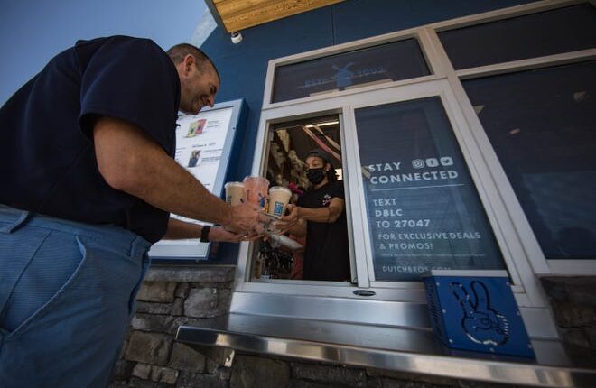 Customers buy drinks at the grand opening of Dutch Bros in Las Cruces on Thursday, June 17, 2021.