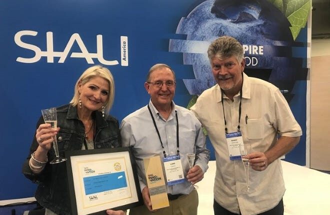 From left, Carol McMillan, Lane Grado, and Randy McMillan of The Fresh Chile Company pose with the SIAL America 2022 Gold Innovation Award.  The Las Cruces-based company received global recognition for its new freeze-dried Hatch Chile product.
