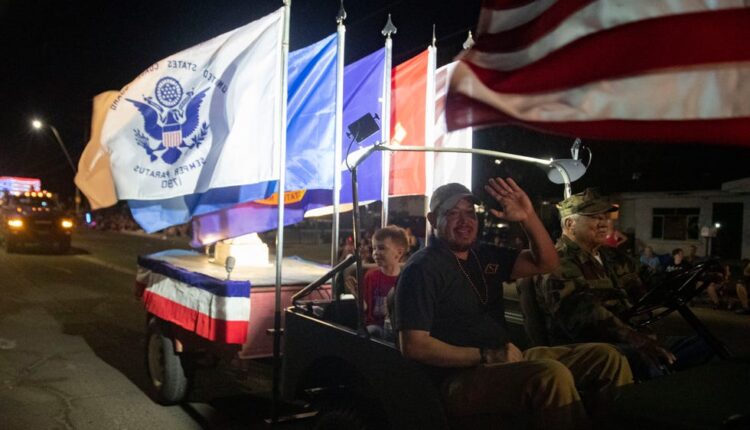 Daniel Munoz, grand marshal of the City of Las Cruces 2022 Electric Light Parade, waves during the parade on Sunday, July 3, 2022.