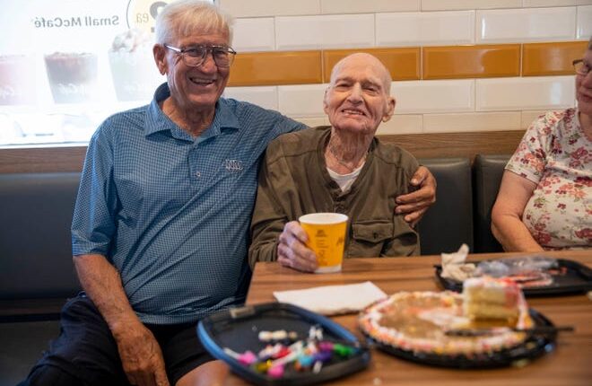 Jack Saunders, right, and his son Jack Saunders Jr., left, celebrates his 104th birthday at the McDonalds he eats at everyday on Tuesday, Aug. 9, 2022. 