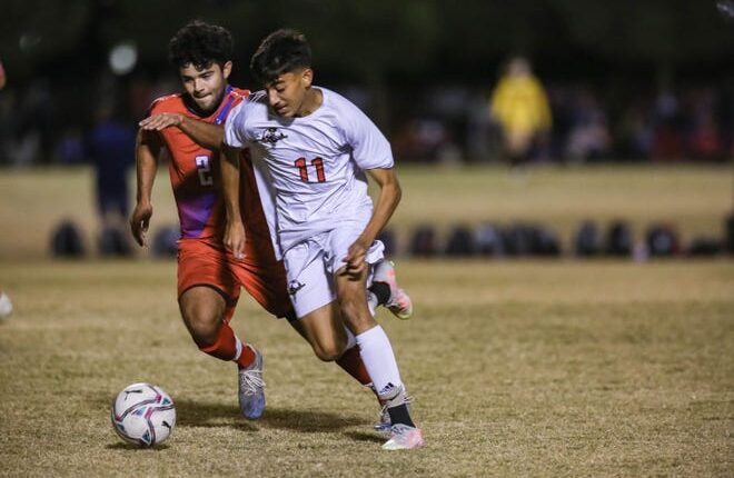 Saleh Alyones (11) works past defenders as the Centennial Hawks face off against the Las Cruces Bulldawgs at the Field of Dreams soccer complex in Las Cruces on Tuesday, Oct.  19, 2021.