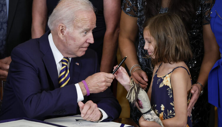 Biden signs landmark bill aiding veterans exposed to burn pits overseas