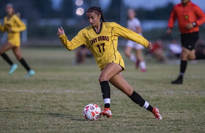 Jadyn Duran (17) works past defenders as the Centennial Hawks face off against the Mayfield Trojans at the Field of Dreams soccer complex in Las Cruces on Tuesday, Sept. 14, 2021.