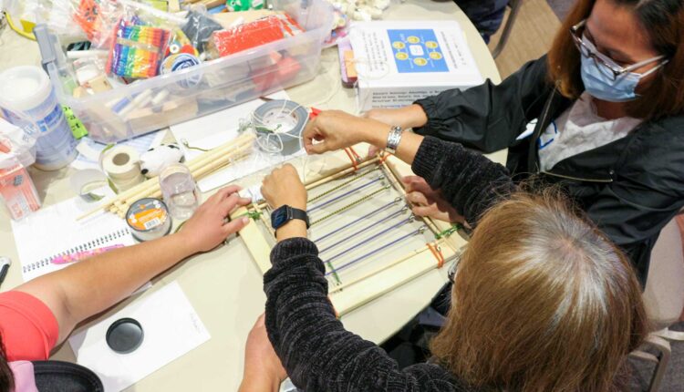 an overhead view of Diné educators working with crafts