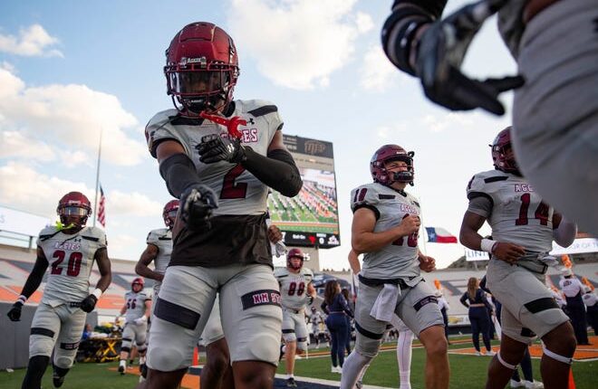 The NMSU football team runs onto the filed before the Aggies football game on Saturday, Sept. 10, 2022, at the Sun Bowl. 