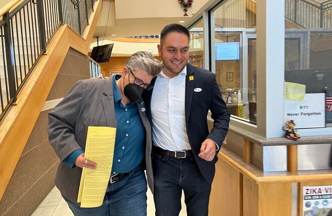 New Mexico state Sen. Carrie Hamblen and congressional candidate Gabe Vasquez, both Democrats, leave the Doña Ana County Government Center in Las Cruces after casting their ballots on the first day of early voting, Tuesday, Nov. 11, 2022.