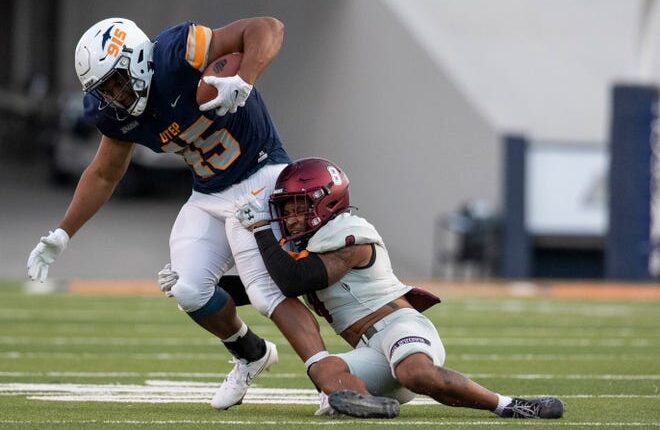 NMSU safety Andre Seldon tackles UTEP Trent Thompson during the Aggies football game on Saturday, Sept. 10, 2022, at the Sun Bowl. 