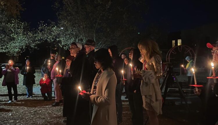 People gather in Morningside Park in Albuquerque on Tuesday, Nov. 22, to mourn the lives lost in the Club Q shooting in Colorado Springs.