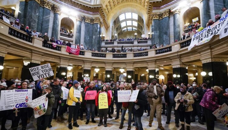 'Here again': Abortion activists rally 50 years after Roe
