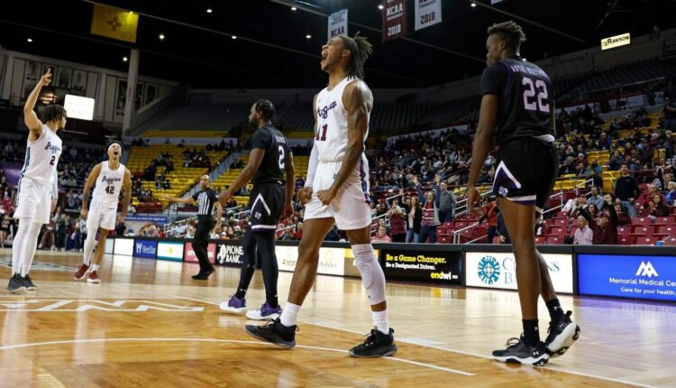 DaJuan Quaye Gordon exults after a slam dunk Feb. 1 as the Aggies earned their first Western Athletic Conference game of the season, defeating Stephen F. Austin 73-67 in the Pan Am Center. They will host Seattle 7 p.m. Saturday, Feb. 4, preceded by the Aggie women playing Grand Canyon in a 4 p.m. game.