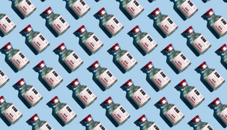A repeating pattern of covid vaccine vials on top of a pale blue background fills the entire image.