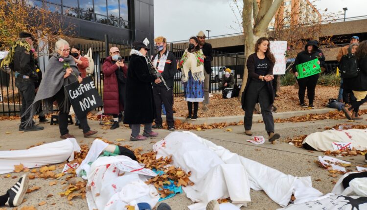 Activists calling for ceasefire in Gaza stage die-in outside representative’s field office